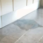signs of water damage under tile