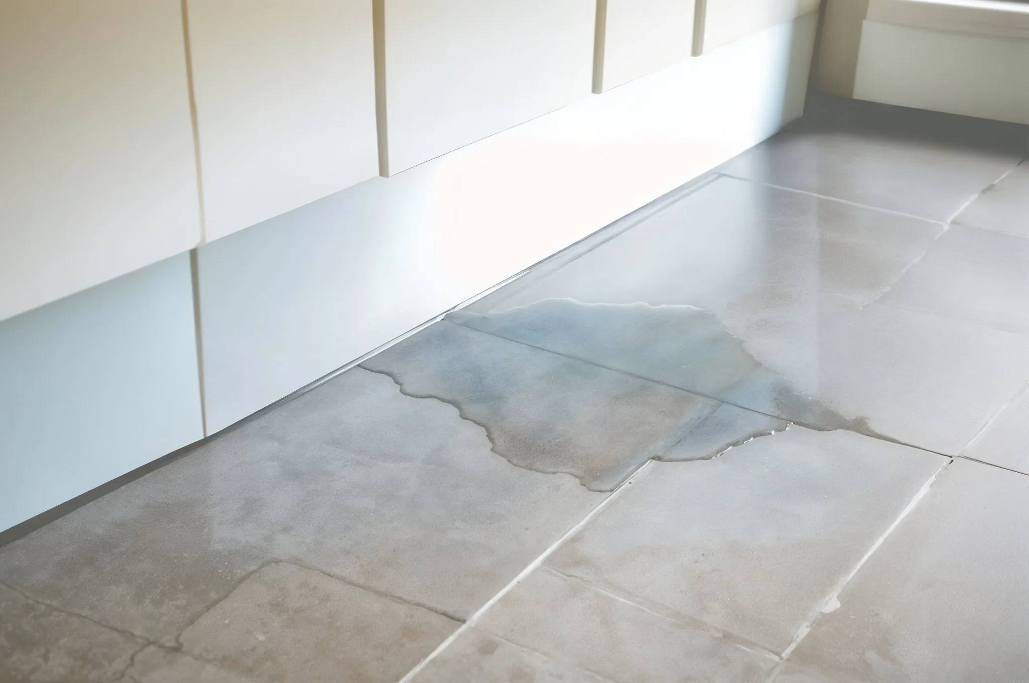 signs of water damage under tile