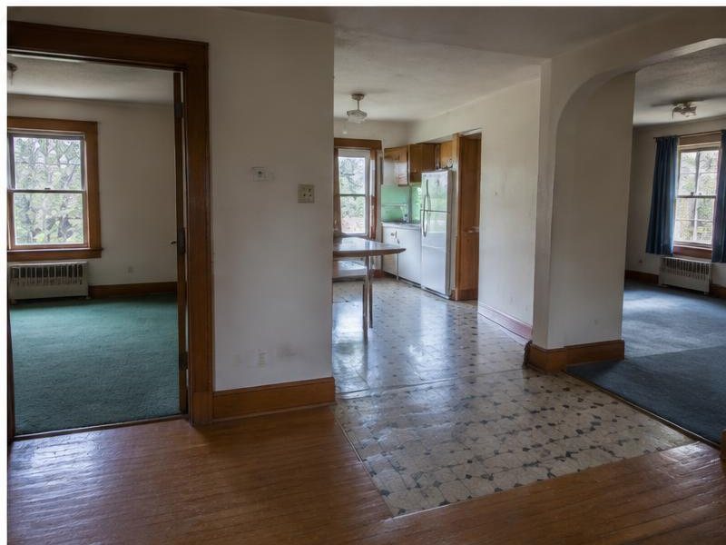 Older home interior with disconnected flooring and room finishes
