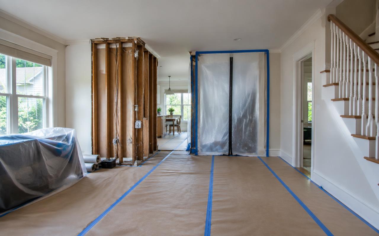 Protected floors and contained work area with a wall opened for remodeling